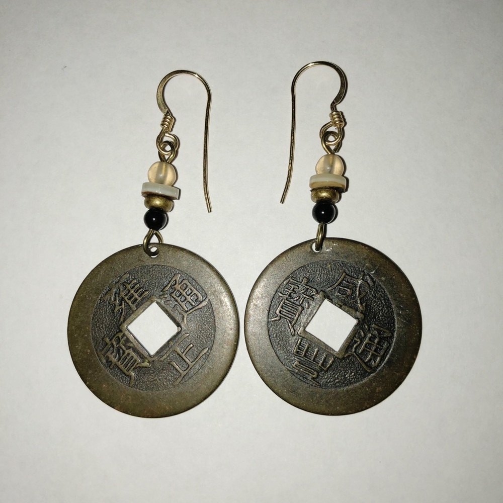 I Ching pierced earrings.